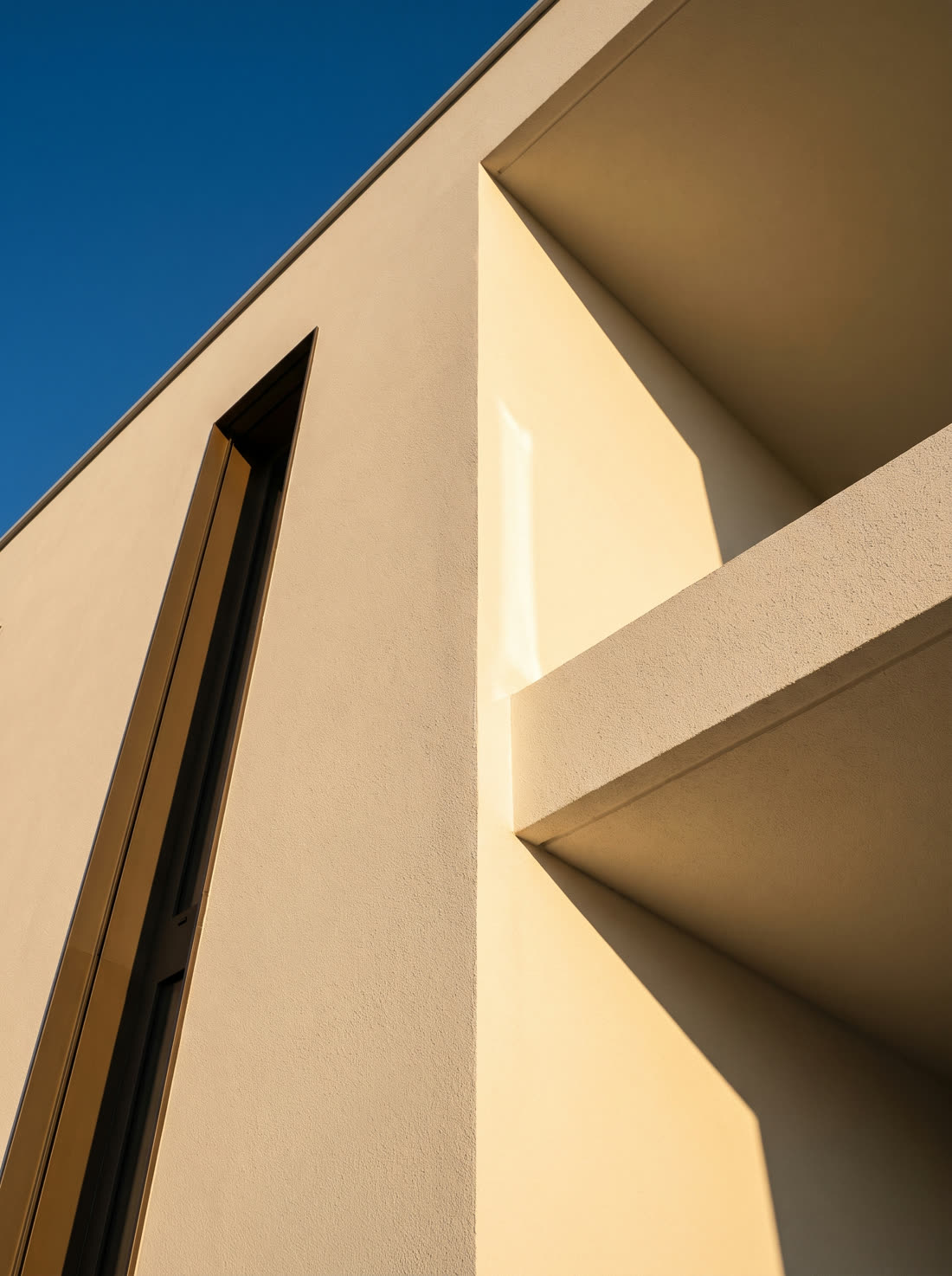 The corner of a finished villa against the sky