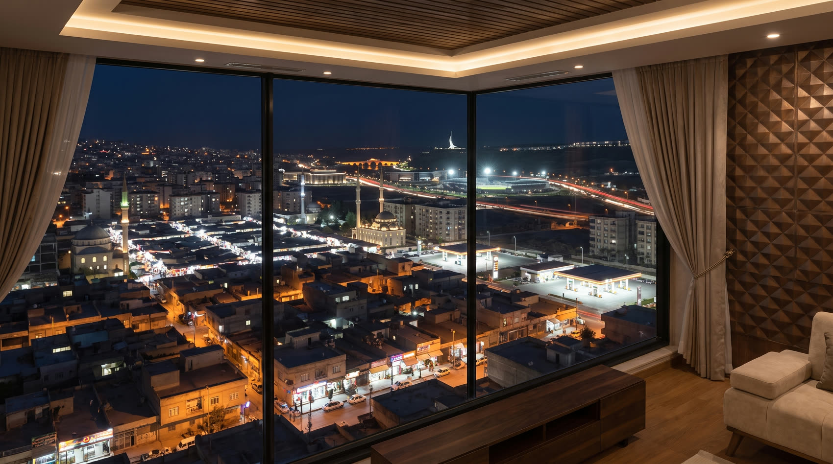 Night view from an SIB apartment across Zakho toward Delal Bridge and the White Village